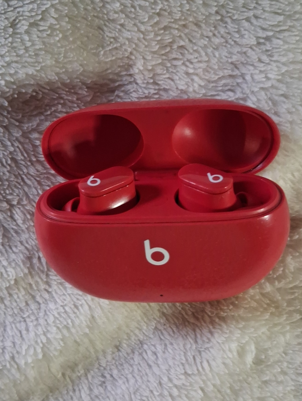 Beats wireless Ear Buds And Red Wireless Earbuds Charging Case